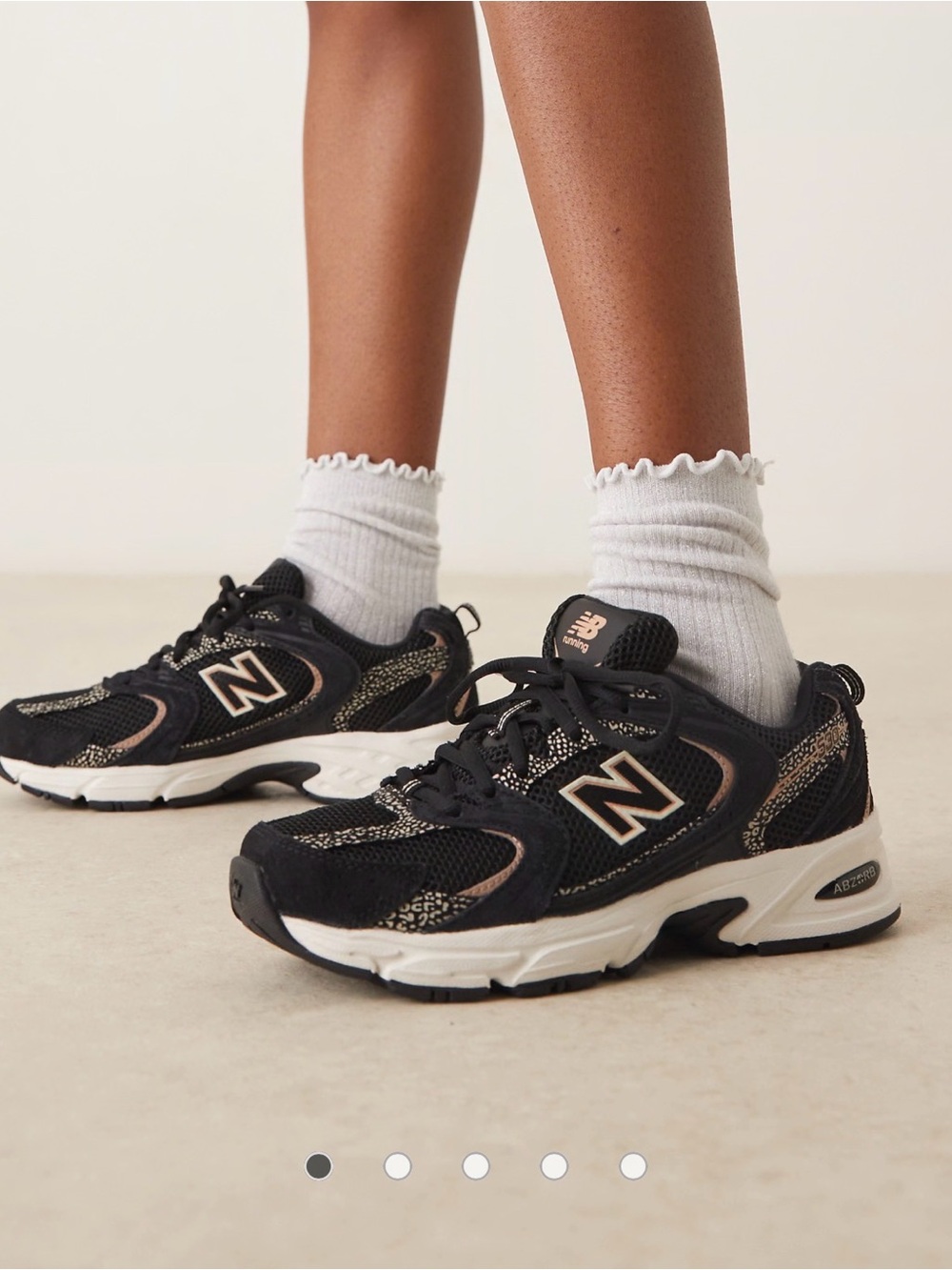 New Balance Black and Cream Women's Athletic Sneakers with Metallic Accents